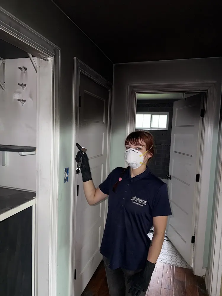 Mile High Water Restoration technician in protective gear on a job in Denver